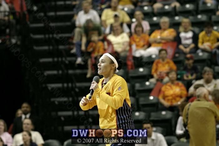 Fever point guard Tully Bevilaqua exhorts the crowd just before tipoff