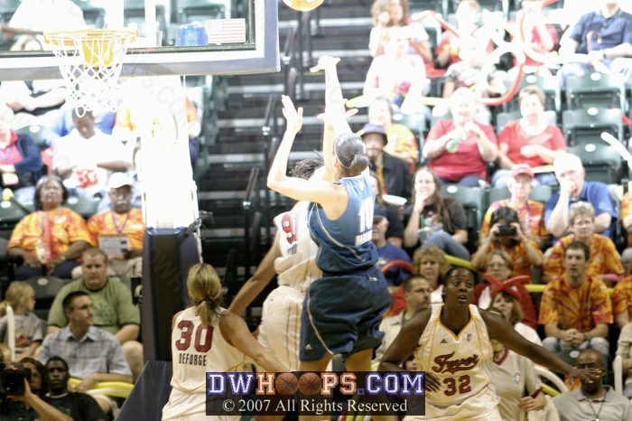 An overhead strobe pretty much spoiled this photo of Lindsey's first official basket, which came after a rough first few minutes.