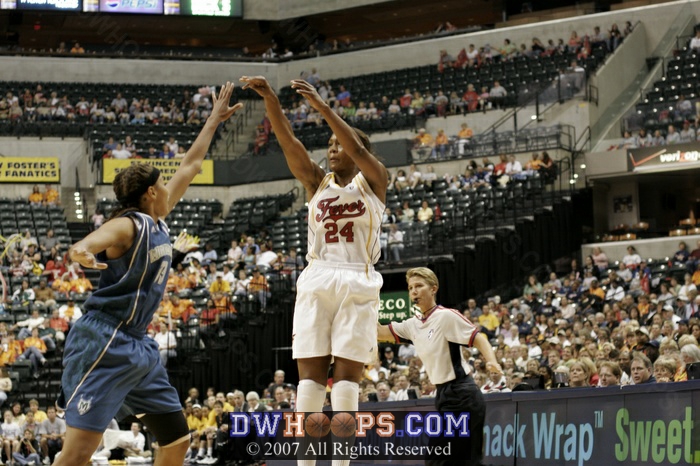 Perennial all-star Tamika Catchings knocks down a jumper over 2006 Rookie of the Year Seimone Augustus