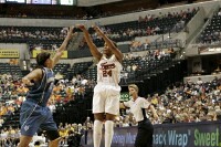  - Perennial all-star Tamika Catchings knocks down a jumper over 2006 Rookie of the Year Seimone Augustus