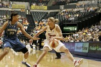  - Anna Deforge (right) works on Seimone Augustus