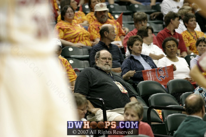 A proud papa looks on from the stands